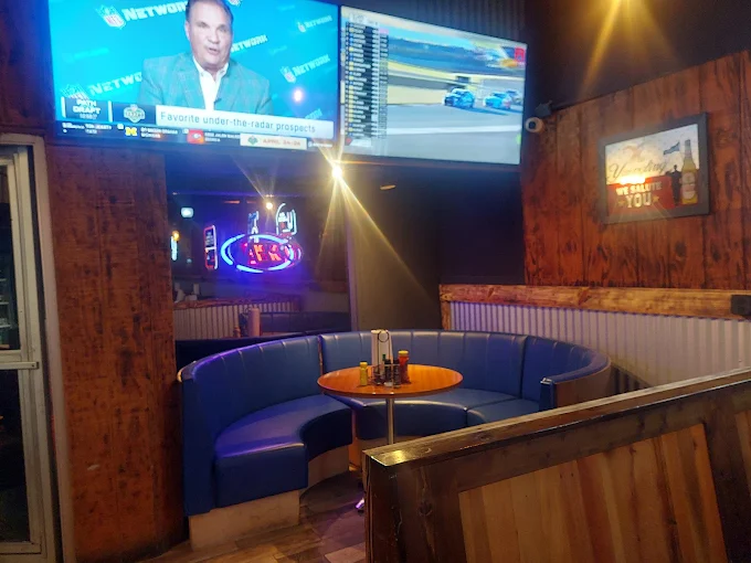 Blue booth seating under TVs