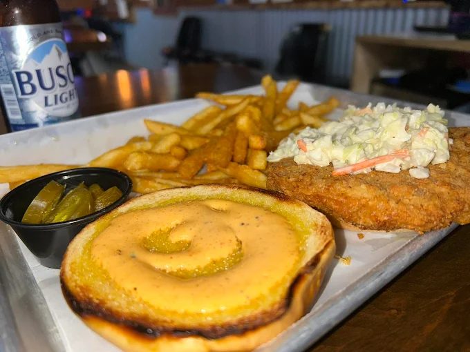 Crispy chicken sandwich with fries and slaw